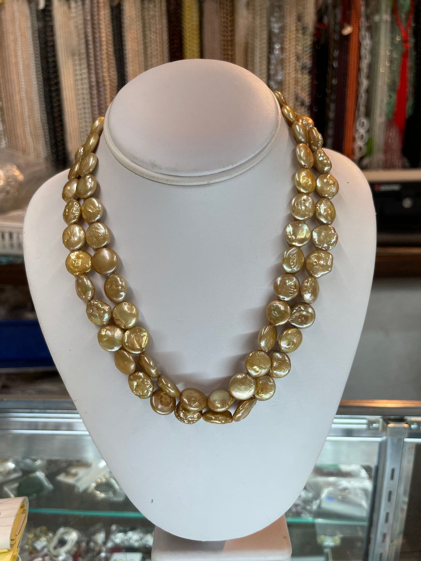 Two stands 19” knot golden coin fresh water pearls necklaces on delicate  fancy gold clasp.